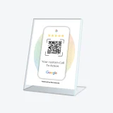 Google Reviews QR code sign used on reception counter to invite customer feedback