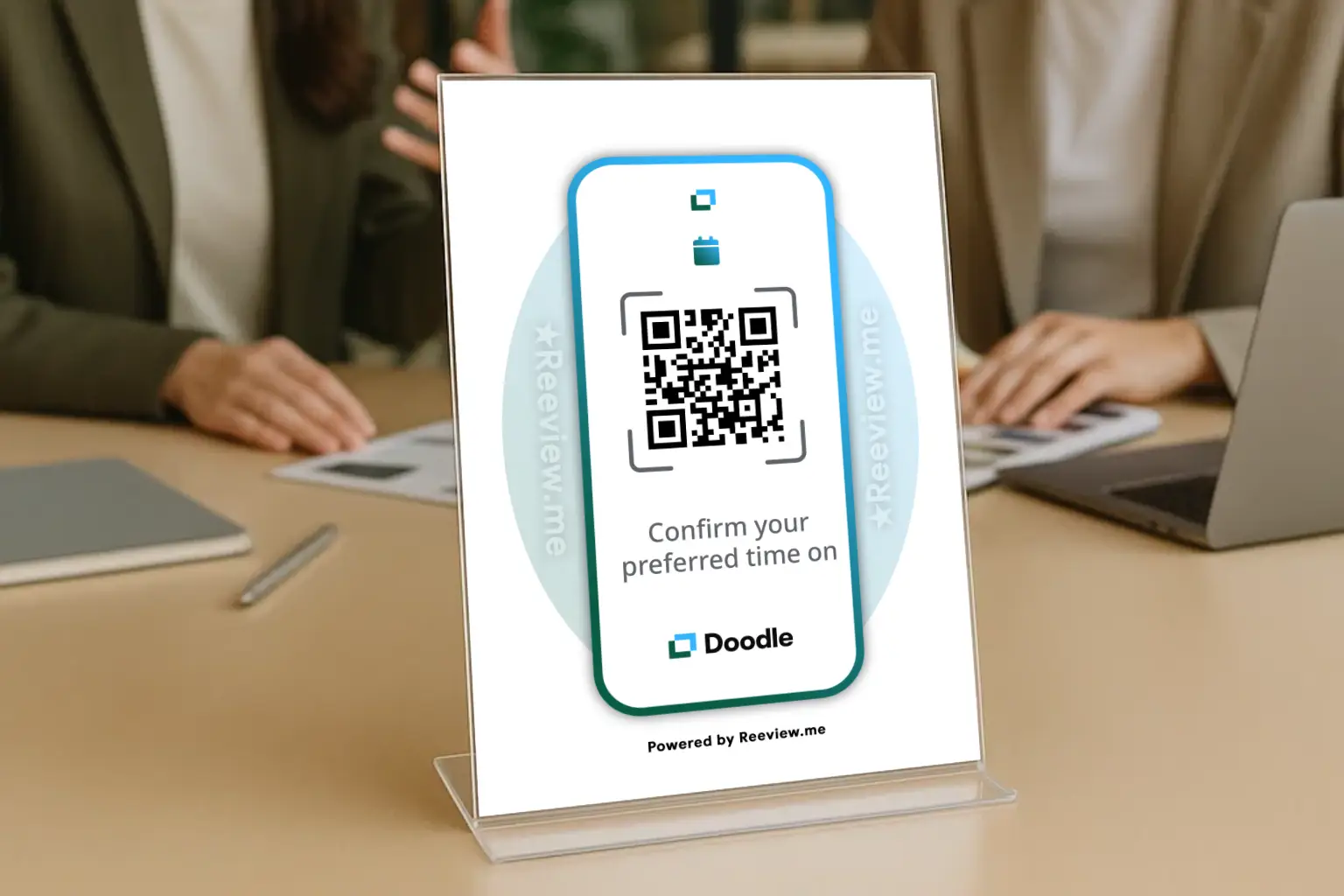 Desk display with QR code helping visitors schedule on Doodle while waiting