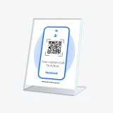 Facebook QR code sign at counter encouraging customers to follow the business online