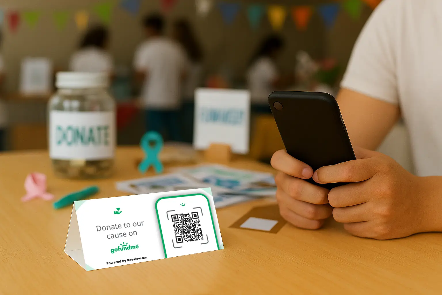 GoFundMe Table tent placed at event table encouraging scan to donate