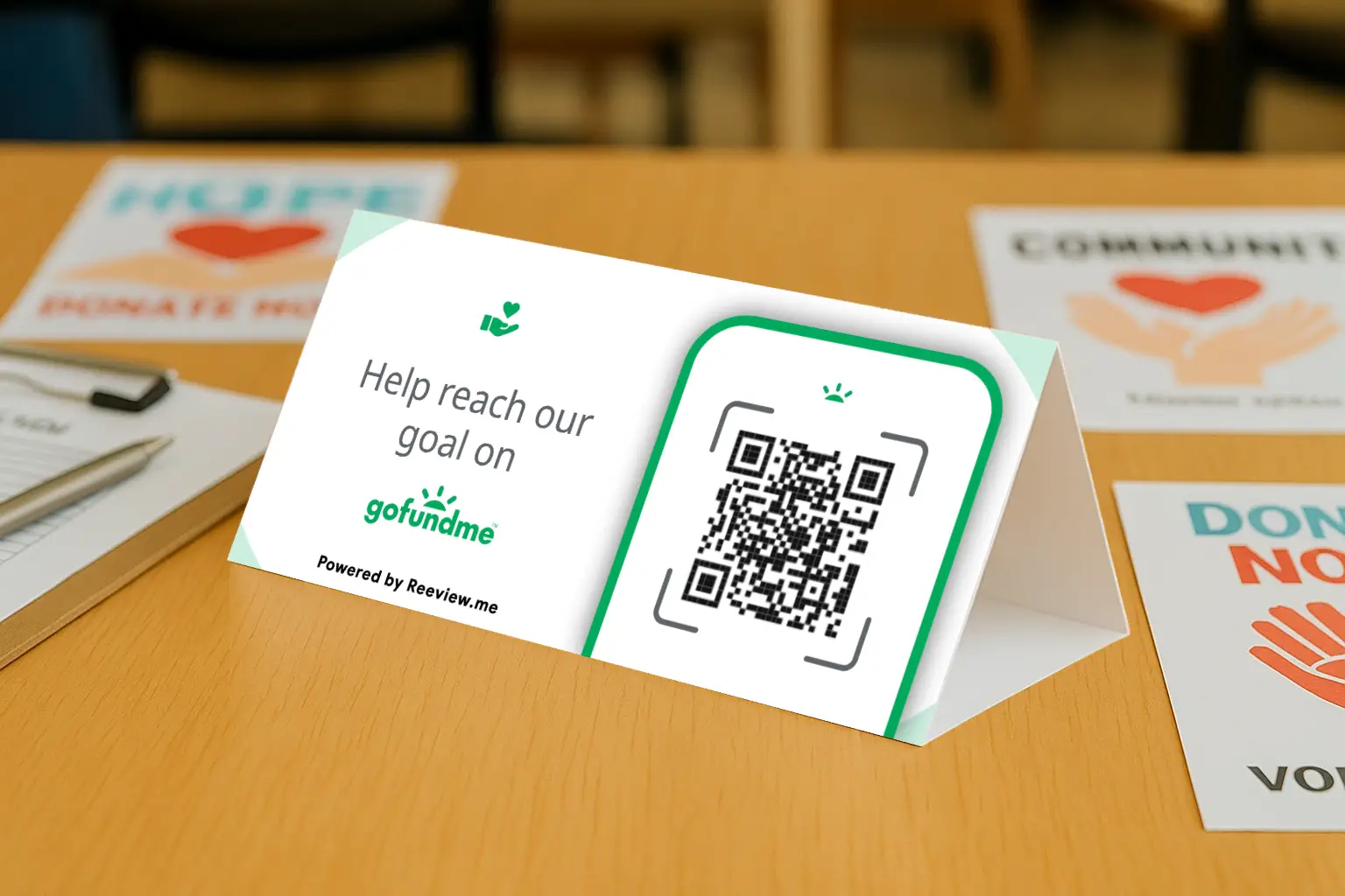 GoFundMe QR Code Table Tent displayed on a table inviting donations
