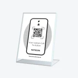 Patreon QR support sign at payment desk encouraging quick supporter engagement
