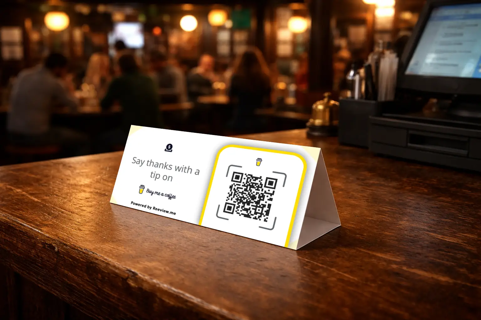Buy Me a Coffee QR code table tent for support placed on a reception desk or counter