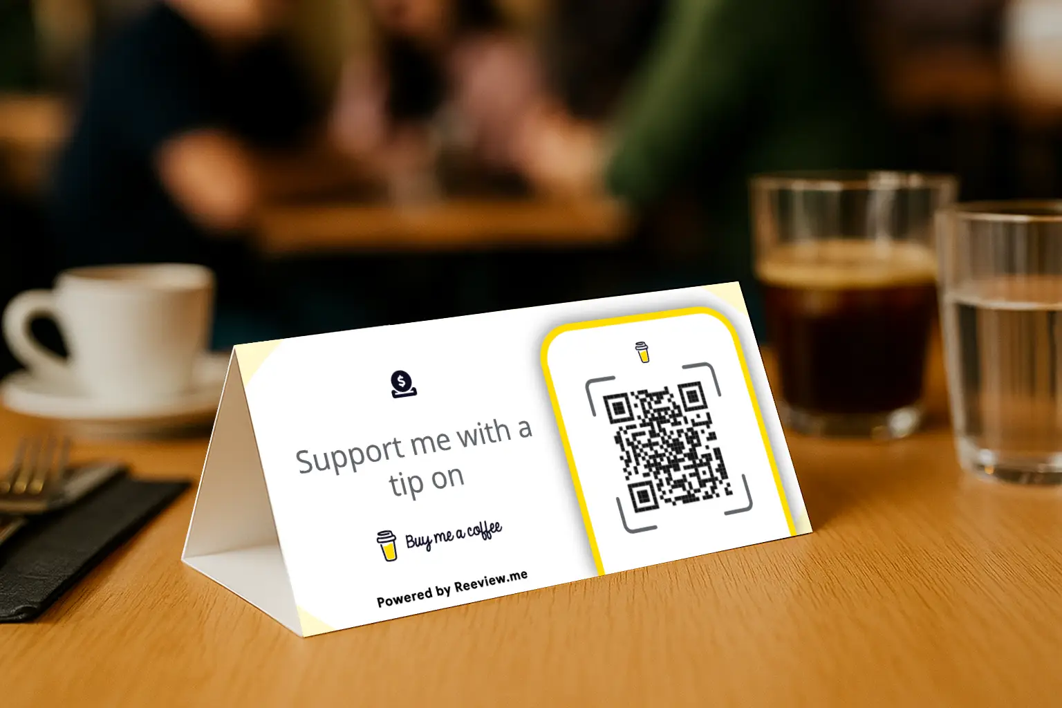 Buy Me a Coffee QR code table tent for support placed on a table