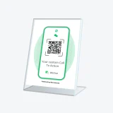 WeChat QR code display sign for chatting with businesses placed on a reception counter