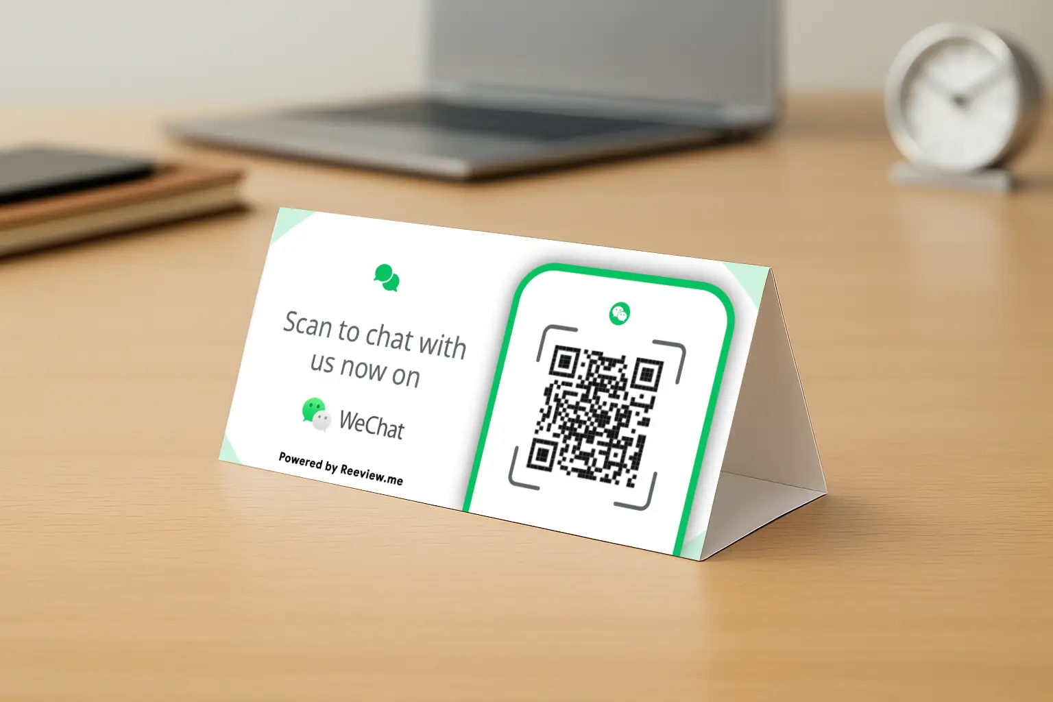 WeChat QR code table tent prompting customers to message while seated at a café table